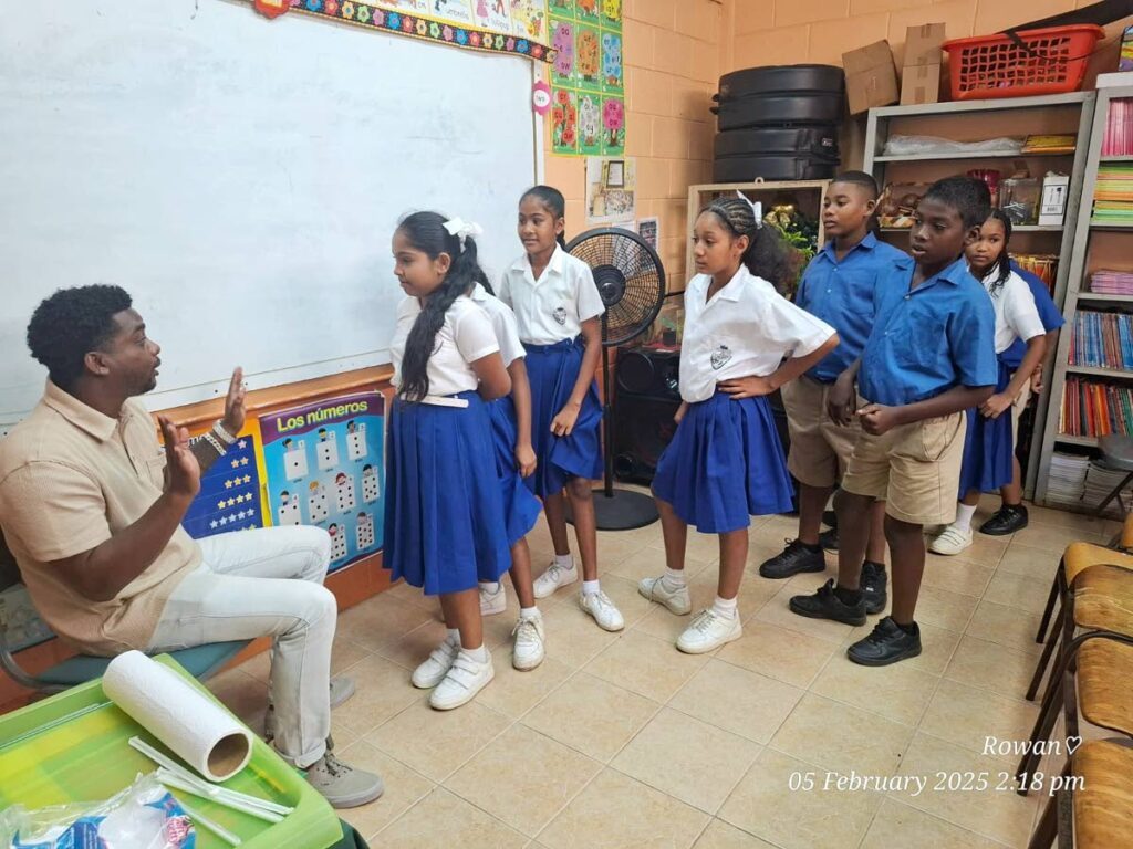 Newsday reporter Joey Bartlett reads to the students at his alma mater, Talparo RC, on World Read Aloud Day, February 5. - 