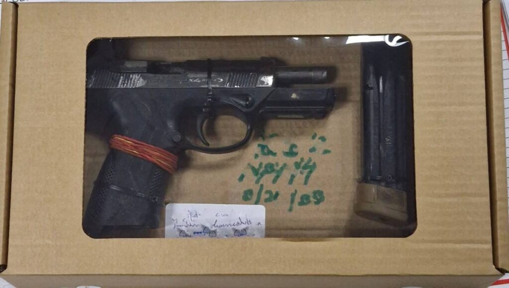 A loaded 9mm Beretta pistol and 20 rounds of 9mm ammunition which were found during the police search on February 7. - Photo courtesy Police Service