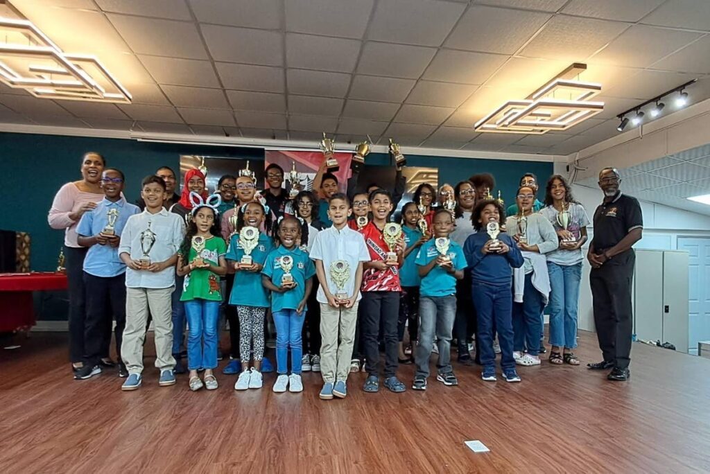 Cheers to chess: Participants show off their trophies at the awards ceremony for the TT Chess Association's National Junior and Youth Chess Championships at ASJA Boys' College, San Fernando on February 2, 2025. - Photo courtesy TTCA  