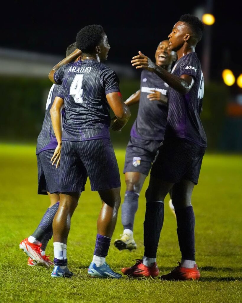 Joshua Araujo-Wilson (4) and teammates celebrate a goal against Point Fortin Civic during a Tier I TT Premier Football League match, at the Mahaica Sporting Complex, Point Fortin.  - (via Defence Force FC)