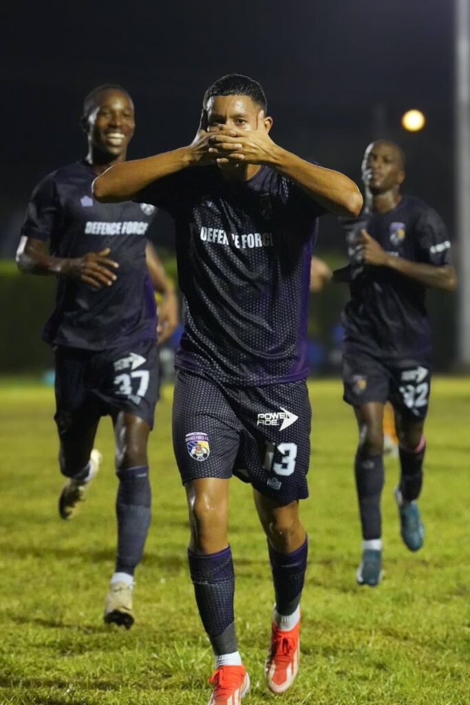 Defence Force midfielder Rivaldo Coryat  (centre) celebrates after scoring versus Point Fortin Civic in a TT Premier Football League match at the Mahaica Sporting Complex in Point Fortin on February 9. - Photo courtesy Defence Force  