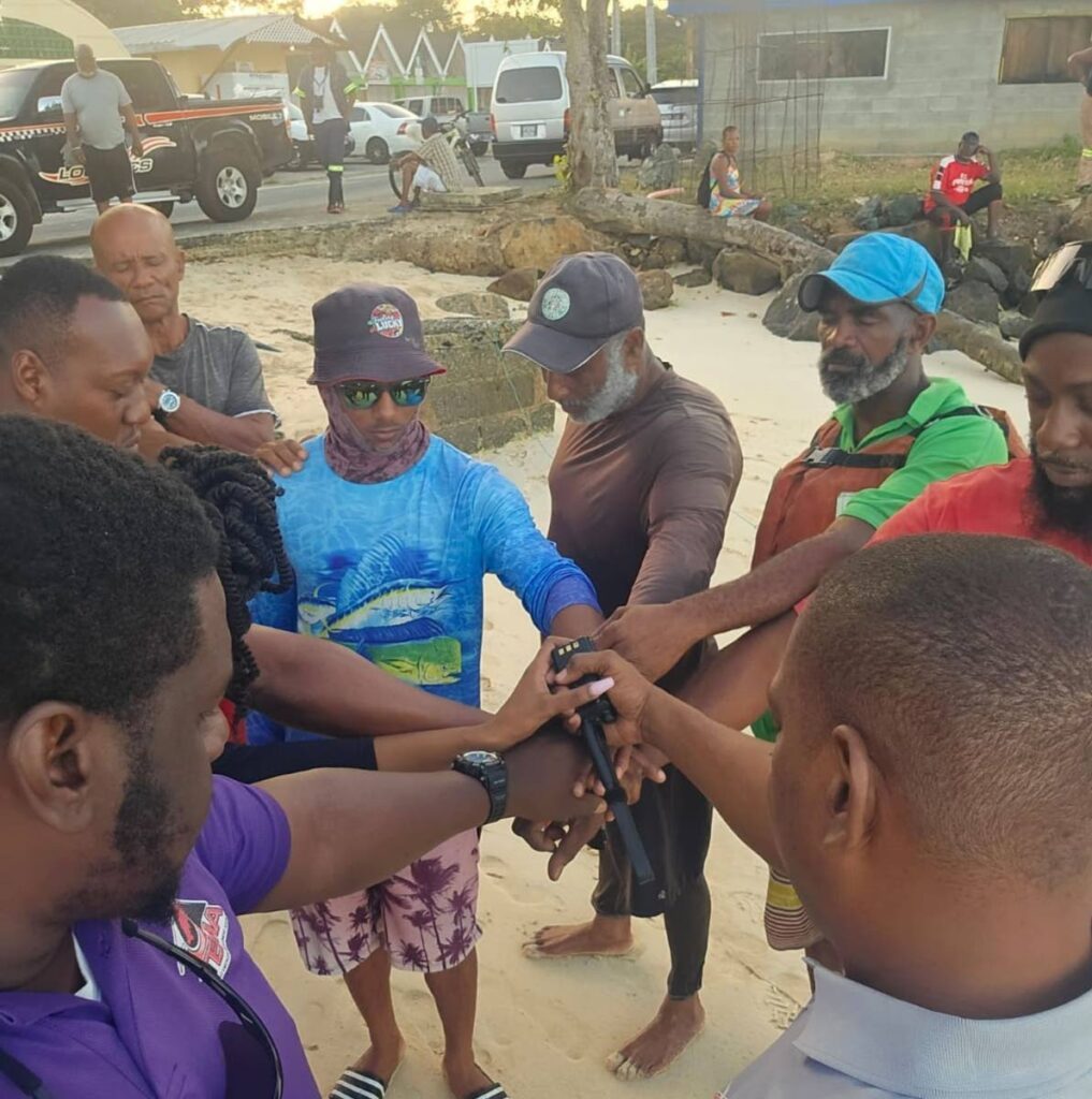 Fishermen and TEMA workers get ready to search for two missing fishermen in Tobago on February 12. - 