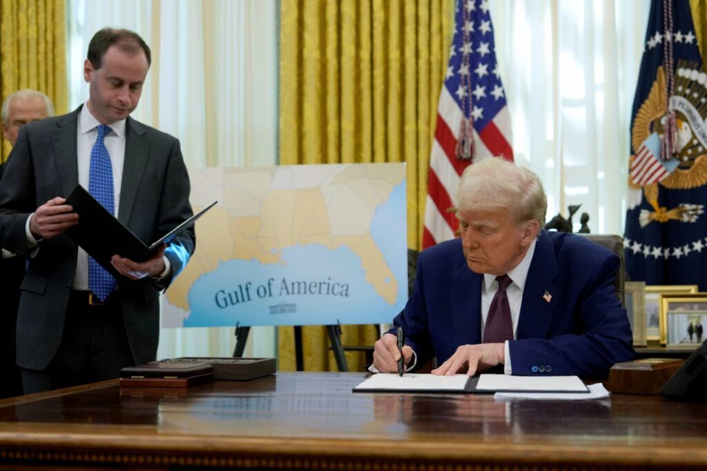 President Donald Trump signs an executive order as White House in Washington. AP Photo - 