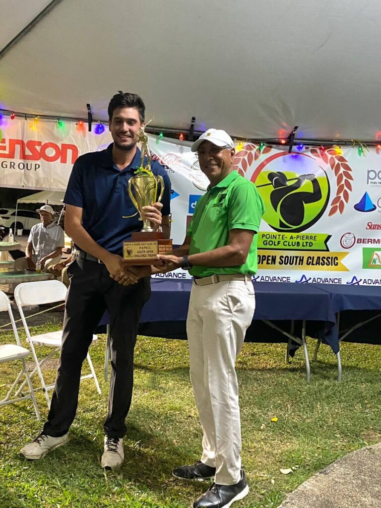 Liam Bryden receives his prize after winning the Pointe-a-Pierre Golf Open championship division on February 16. - Photo courtesy TTGA