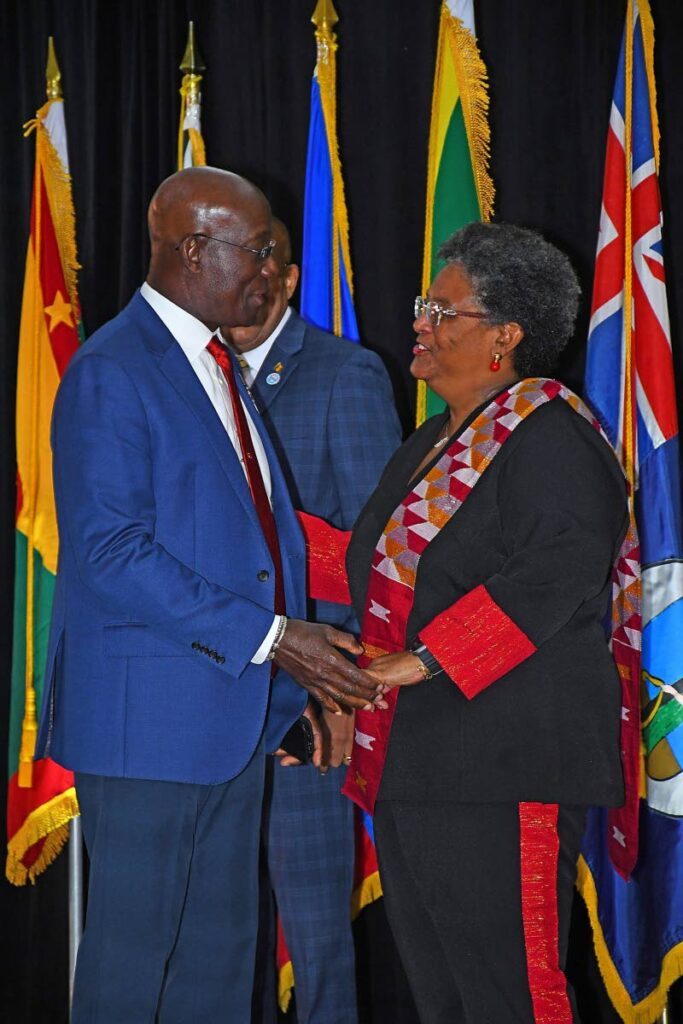 The Prime Minister greets incoming Caricom chairman, Barbados Prime Minister Mia Mottley, at the opening ceremony of the Caricom 48th Regular Meeting of Heads of Government in Barbados on February 19. - Photo courtesy Dr Rowley's Facebook page