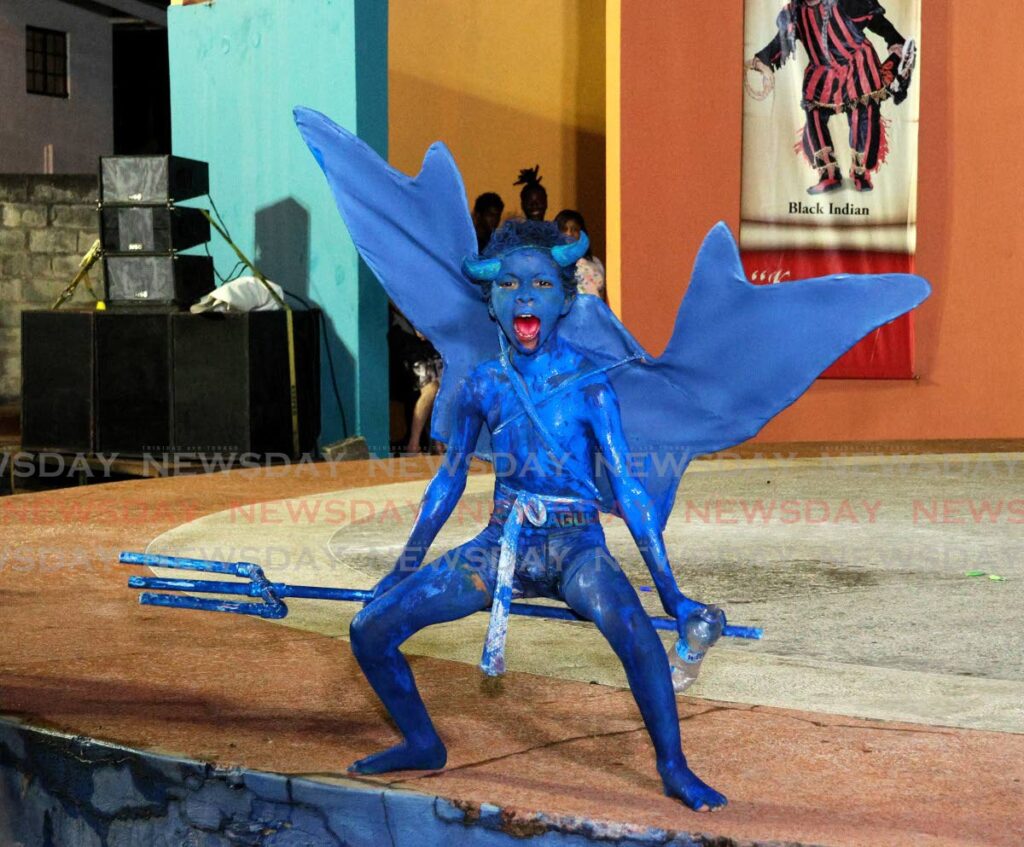 Malachi Fournillier, 8, captures the crowd with his portrayal of a blue devil at the St James Social & Cultural Committee Traditional Mas Competition on February 20. - Photo by Faith Ayoung