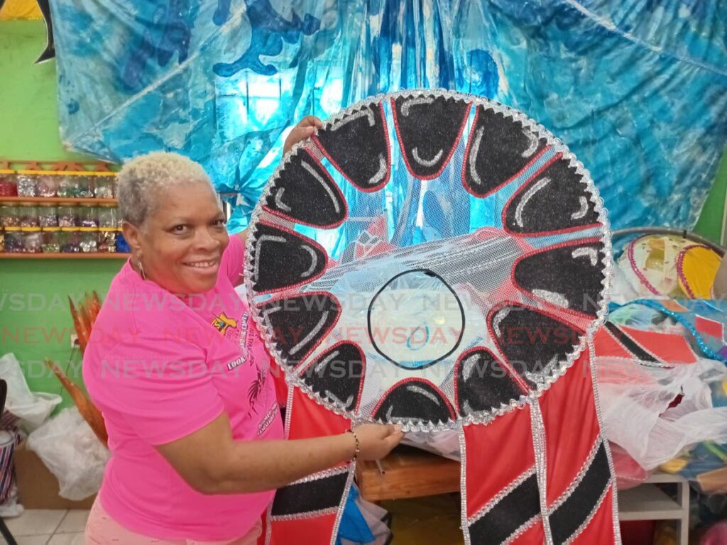 Vanessa Forde shows one of the costumes at her Belmont mas camp. - Photo by Jelani Beckles