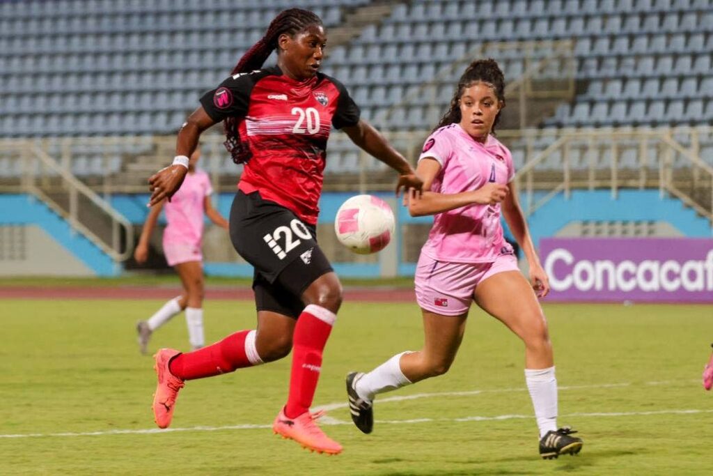 Trinidad and Tobago's Natalie Penniston-John (L) tries to evade her Bermudan counterpart during their Group E Concacaf Under-20 Women's qualifier, on February 21, 2025, at the Ato Boldon Stadium, Couva. - Photo courtesy TTFA Media