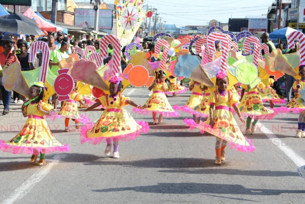 Young masqueraders enjoyed parading their fancy costumes from the band Bakken, with the presentation Dem Carnival In We Carnival by Sparks Legacy during Marabella Kiddies Carnival parade of bands at Southern Main Road, Marabella, on February 23.  - Photo by Innis Francis