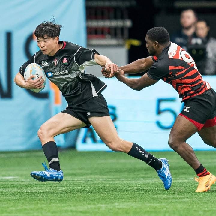 TT men's rugby player Jonathan Taylor, right, tries to stop his Japanese opponent during their countries' clash at the VAN SVNS at BC Place in Vancouver on February 21.  - Photo courtesy Japan Rugby Football Union's Instagram page  