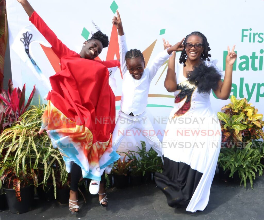 CALYPSO’S FUTURE: Xhaiden Darius, centre, of Savonetta Primary School jumps for joy after winning the National Junior Calypso Monarch title at the Queen’s Park Savannah, Port of Spain, on February 24. On his right is second-place winner Koquice Davidson of Bishops’s High School, Tobago, and on his left is Nataki Thompson of Scarborough Secondary who placed third. - Photos by Angelo Marcelle