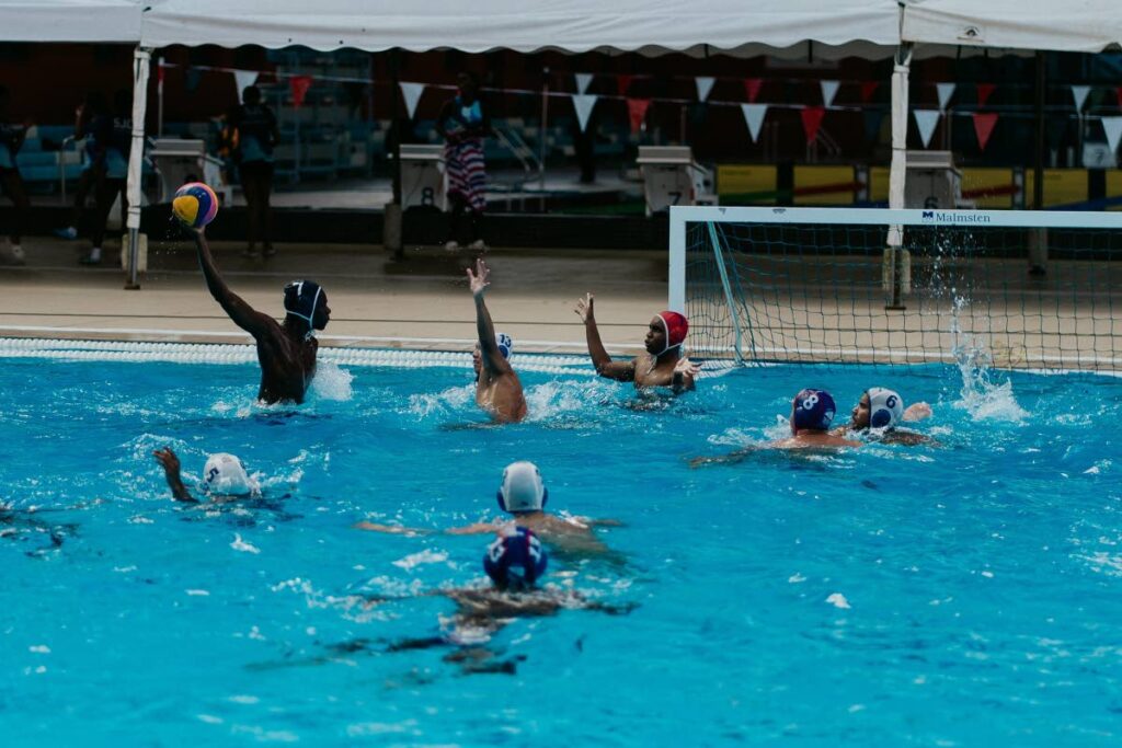 St Mary's College's Evan Gillard-Bruce (L) takes aim at goal versus Fatima College during their match in the Republic Bank National Secondary Schools Water Polo League at the National Aquatic Centre in Balmain, Couva on February 8. - Photo courtesy National Schools Water Polo Series 