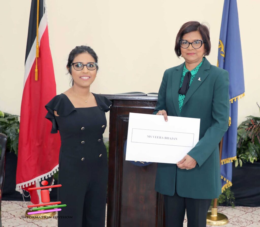 Veera Bhajan, left, receives her instrument of appointment as a lay assessor of the Equal Opportunity Tribunal from President Christine Kangaloo in March 2024. - Photo courtesy Office of the President