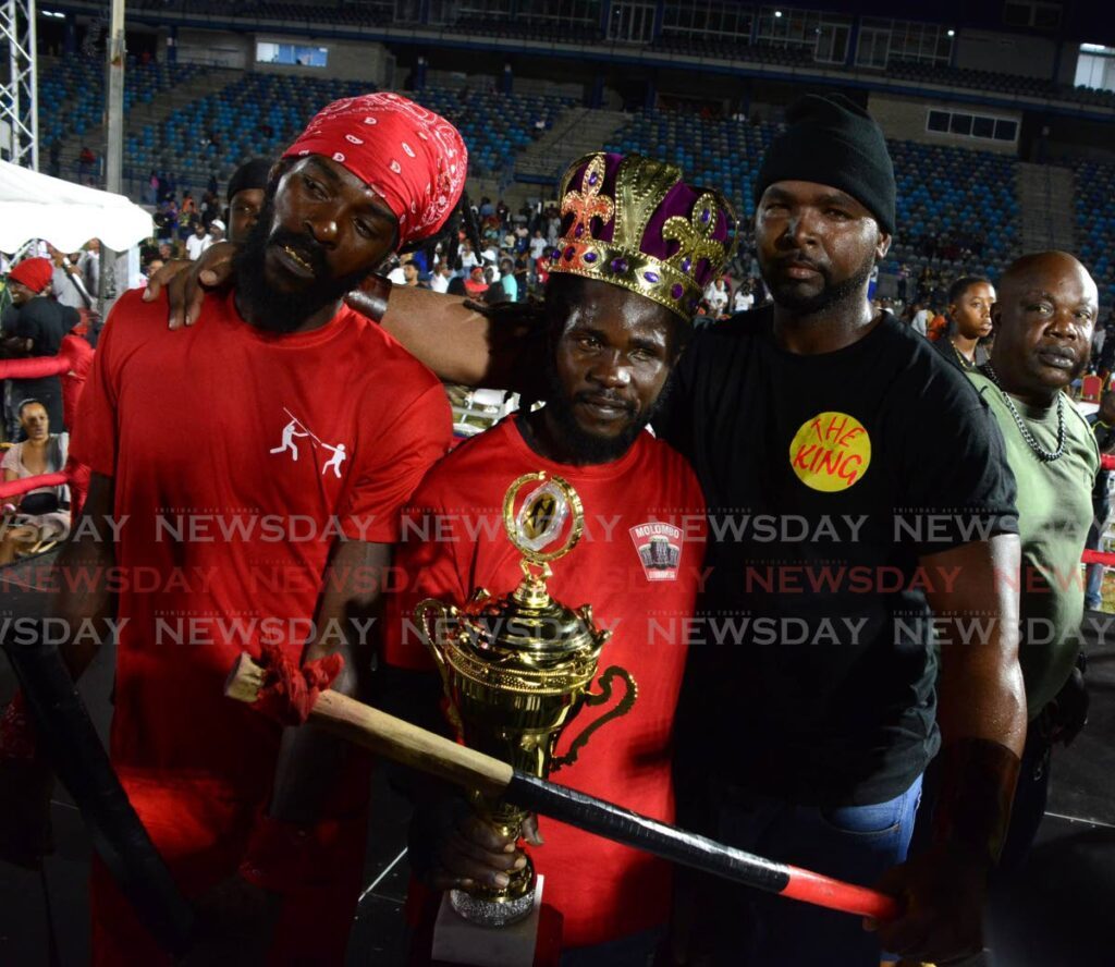 Boismen Selwyn John, left, and O’Neil Odle, right, placed third and second to King of the Rock Anderson Marcano, centre at the 2025 National Stickfighting Finals at Skinner Park, San Fernando, on February 26. - Photos by Innis Francis