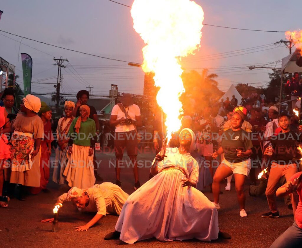 A performer spits fire during Kambule, a Canboulay riots re-enactment, at Piccadilly Greens, Port of Spain, on February 28. - Photo by Ayanna Kinsale