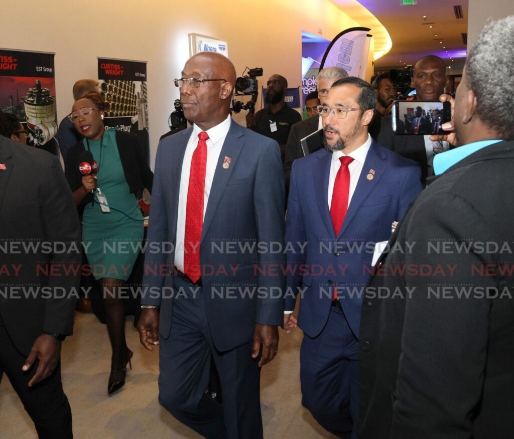 Prime Minister Dr Keith Rowley, left, and Energy Minister Stuart Young arrive on the first day of the TT Energy Conference 2025, Hyatt Regency, Port of Spain on February 10. - Photos by Faith Ayoung