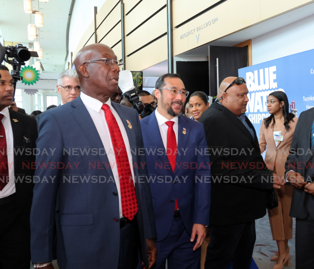 The Prime Minister, left, and Energy Minister Stuart Young, centre, at the TT Energy Conference 2025 at the Hyatt Regency on Wrightson Road, Port of Spain, on February 10. - Photo by Faith Ayoung