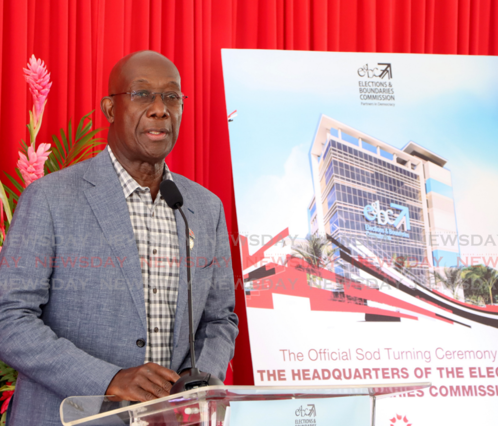 The Prime Minister speaks during the sod-turning ceremony for a new Elections and Boundaries Commission headquarters on the corner of Lamy Street and Saddle Road, St Clair, on February 12. - Photos by Ayanna Kinsale