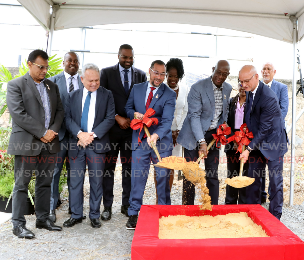 The Prime Minister, centre, Minister of Energy and Energy Industries Stuart Young, left, and chairman of the Elections and Boundaries Commission Mark RamRamkerrysingh turn the sod for a new EBC headquarters in St Clair, on February 12.