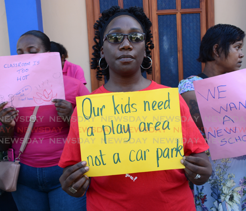 Shamfa Mentor speaks to media on behalf of concerned parents during a protest for better conditions for schoolchildren housed at the St Dominic's RC Church on February 10. - Photos by Innis Francis