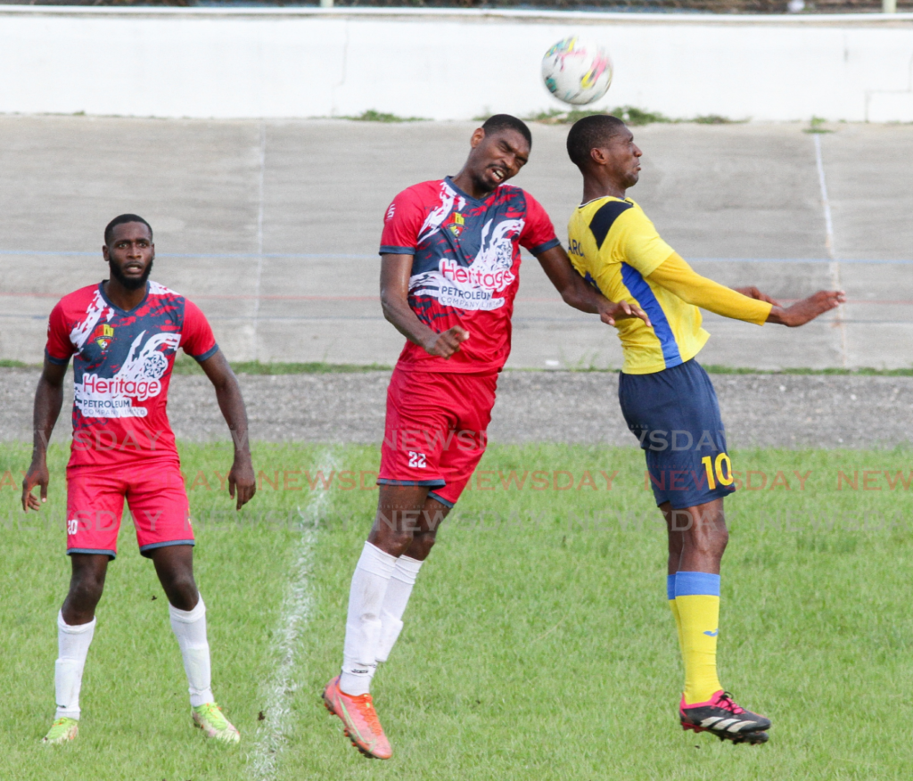 Defence Force's Hashim Arcia, right, challenges for a ball in a TT Premier Footballl League match in 2023. - File photo by Angelo Marcelle 