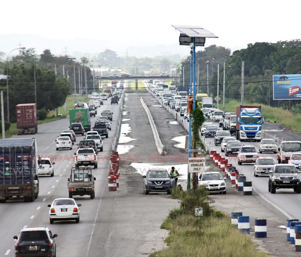 Traffic jams caused by  Solomon Hochoy Highway widening project from the Chaguanas overpass to the Chase Village overpass. - Photo by Lincoln Holder