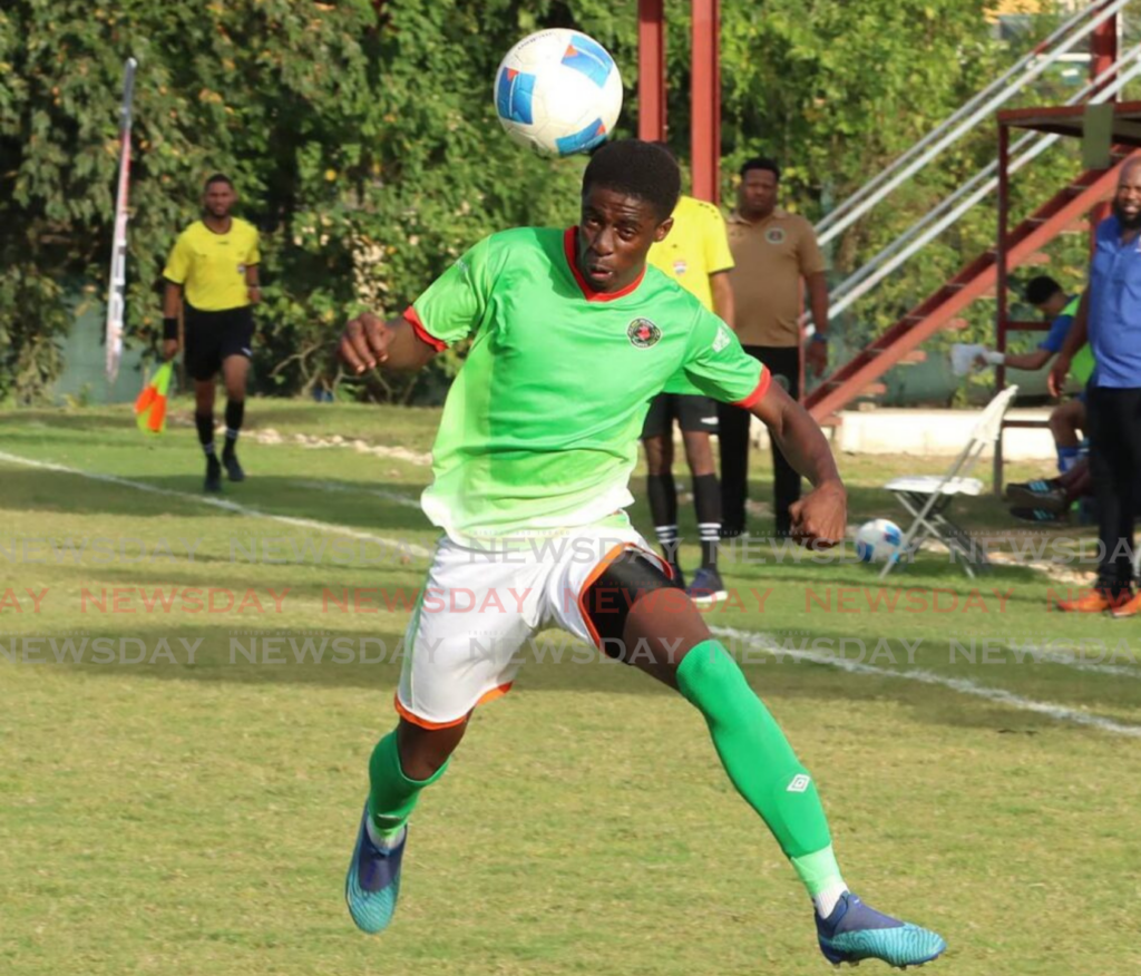 Andell Fraser of San Juan Jabloteh controls the ball with his head against Club Sando, at La Horquetta Recreational Ground on Friday.  - Photo by Angelo Marcelle