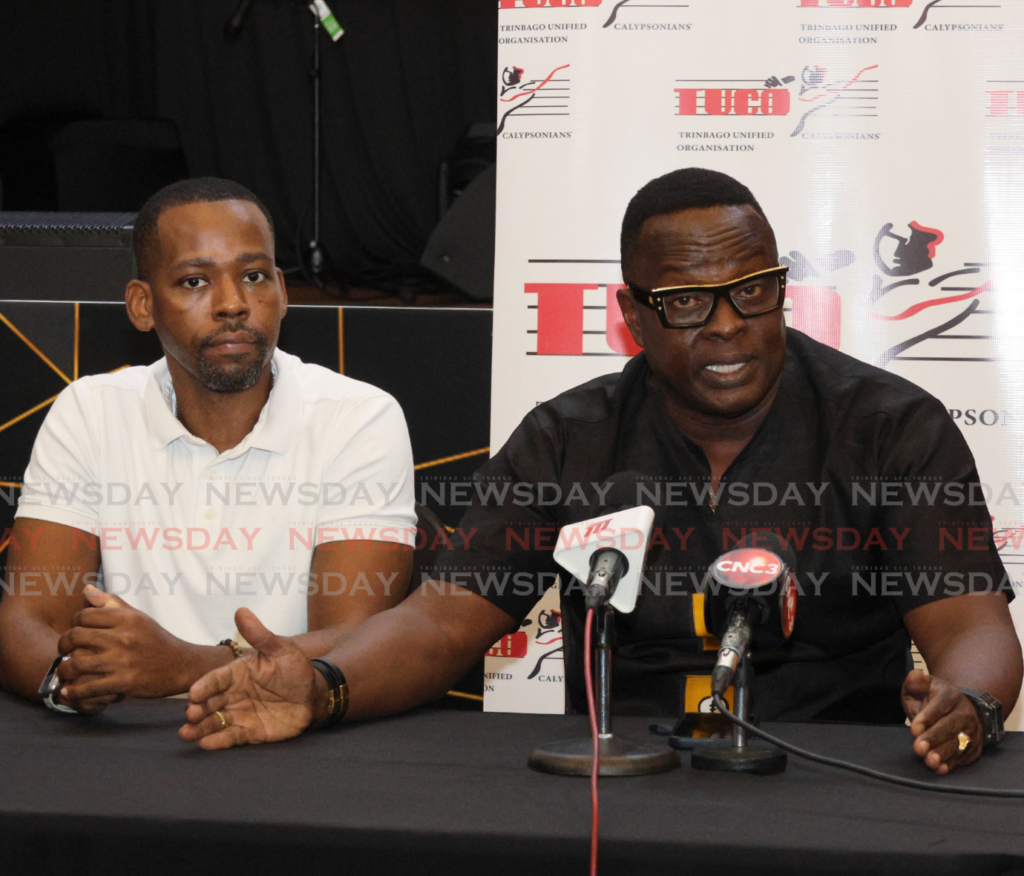 Trinbago Unified Calypsonians Organisation (TUCO) president Ainsley King, right, and PRO Rondell Donawa announce the 40 semifinalists for the Calypso Monarch competition at a media briefing at the Raddison Hotel, Port of Spain, on Feburary 16. - Photo by Faith Ayoung