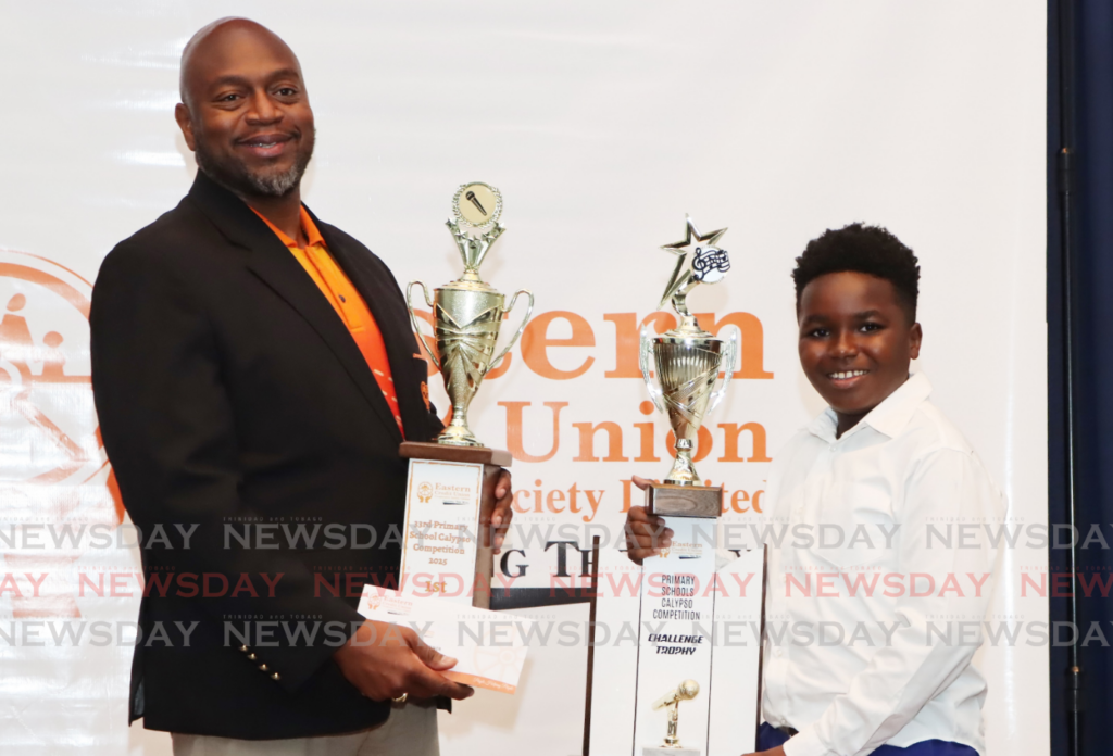 Zachary Ransome receives his trophies from Eastern Credit Union's deputy CEO Kester Lashley on Thursday at the Eric Williams Auditorium, La Joya Complex, St Jospeh. - Photos by Ayanna Kinsale 