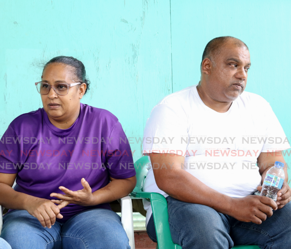 Lisa Williams and Shevlin Williams, parents of PC Shzeem Aaron Williams, who died in a crash, talk to Newsday on February 9 at their home in Carapichaima. - Photo by Innis Francis