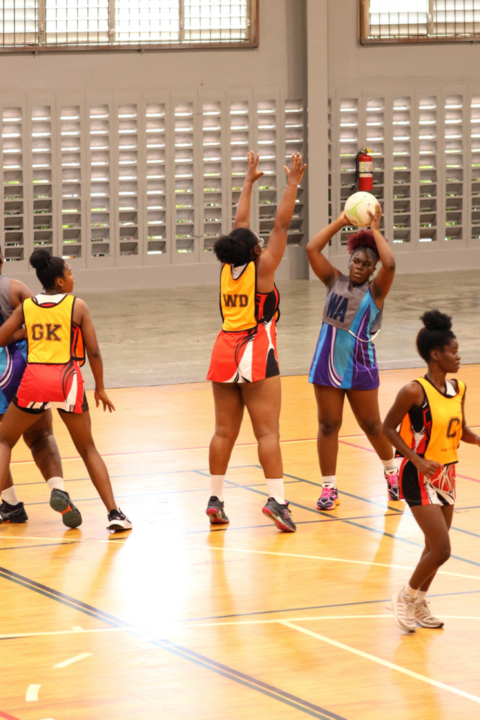 Police’s Sparkle DeFour handles the ball as UTT’s Shenice Gittens defends during the Courts All Sectors Netball League game, on February 8, at the Eastern Regional Indoor Arena, Tacarigua. - Photo by Faith Ayoung