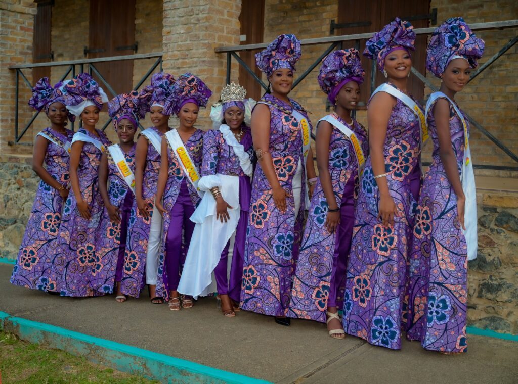 Reigning queen Kersha Kent, of Delaford, centre, with the nine delegates vying for the Windward Afro Queen crown on February 26. - Photo by Visual Styles