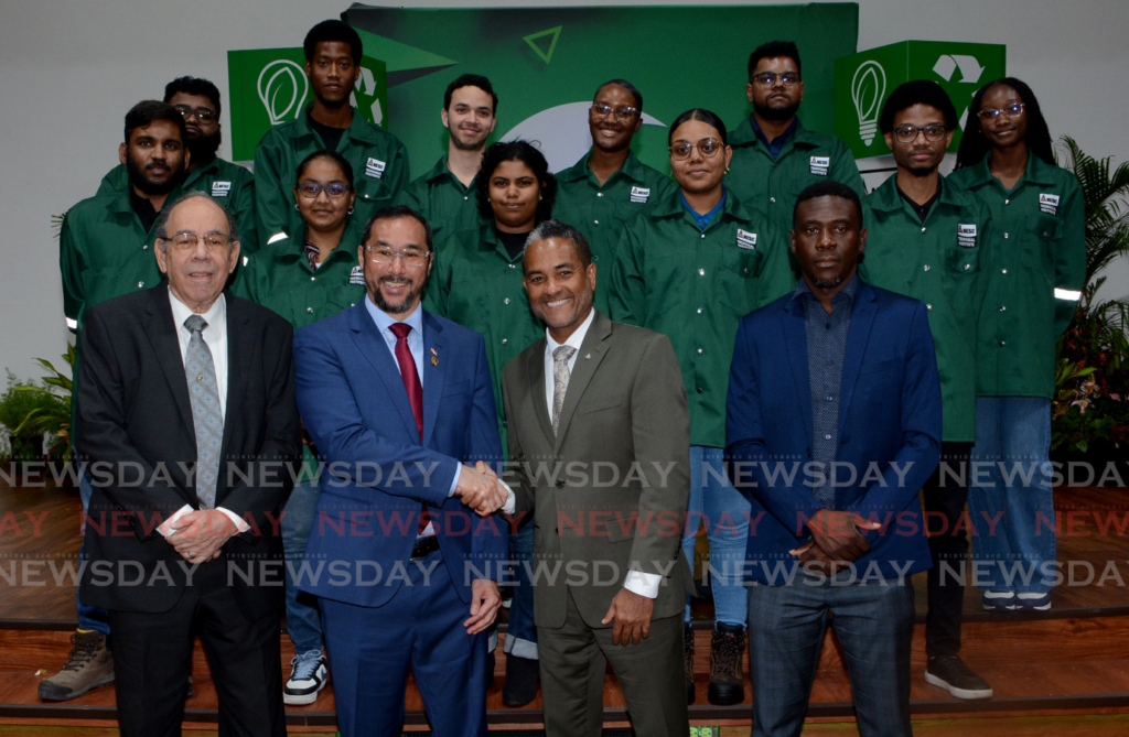 Front row, from left, NESC-IT chairman Hayden Ferreira, Minister of Energy and Energy Industries Stuart Young, exchange handshakes with NESC-TI president Kern Dass, and School of Continuing Education NESC-TI acting dean Kofi Toney with recipients of the Renewable Energy Technology Services Scholarship Programme at the launch at NESC-TI Auditorium, Point Lisas on February 3. - Photo by Innis Francis