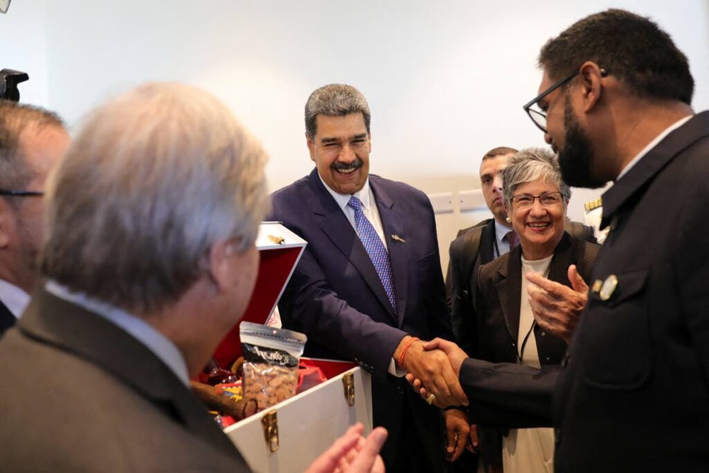 In this file photo, Venezuela's President Nicolas Maduro, centre, and Guyana's President Irfaan Ali shake hands during the CELAC Summit in Buccament Bay, St Vincent and the Grenadines on March 1, 2024. - AFP PHOTO