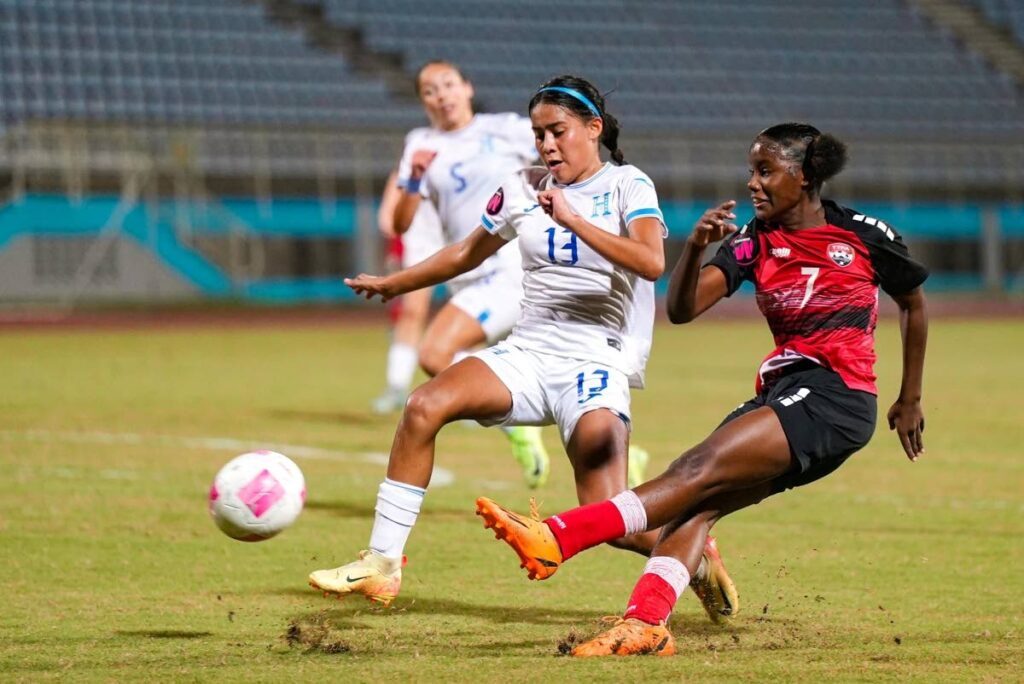 In this photo taken on January 31, TT under-17 women’s flanker Rasheda Archer whips in a cross against Honduras in their 2025 Fifa Under-17 
Women’s World Cup qualifier at the Ato Boldon Stadium, Couva. - 