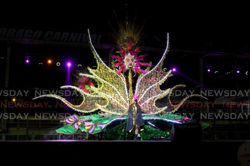 Makeshi Leach crosses the stage in his senior king of Carnival costume titled Wings of Hope and Love  at the Senior Kings and Queens of Carnival semi-finals at the Queen’s Park Savannah, Port of Spain, on February 26. - Photo by Faith Ayoung