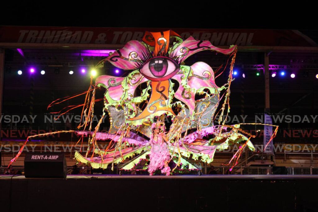 Anna Jardine crosses the stage in her senior queen costume, Edenonia – A Breath of Fresh Air, at the Senior Kings and Queens of Carnival semi-finals. - Photo by Faith Ayoung