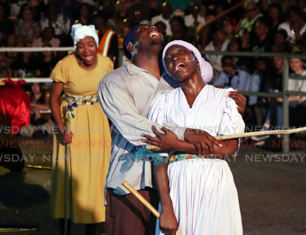 Actors perform during the Canboulay riots re-enactment at Piccadilly Greens, Port of Spain on February 28. - Photo by Ayanna Kinsale