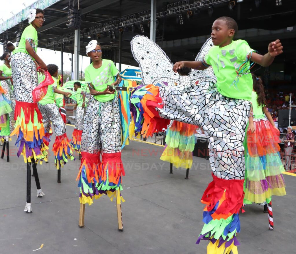 Jaydon Diaz,12,  left, with other moko jumbies in Kaisokah Valencia for Kiddies Carnival, Queen's Park Savannah on March 1.  - Photos by Angelo Marcelle