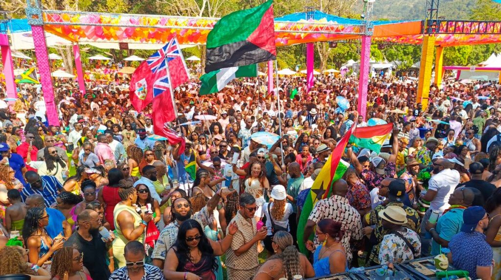 Flags from multiple countries are flown by visiting residents for Carnival, during Sunnation’s Sunrise breakfast party at St Andrew’s Golf Course, Moka, Maraval on February 28.  - 