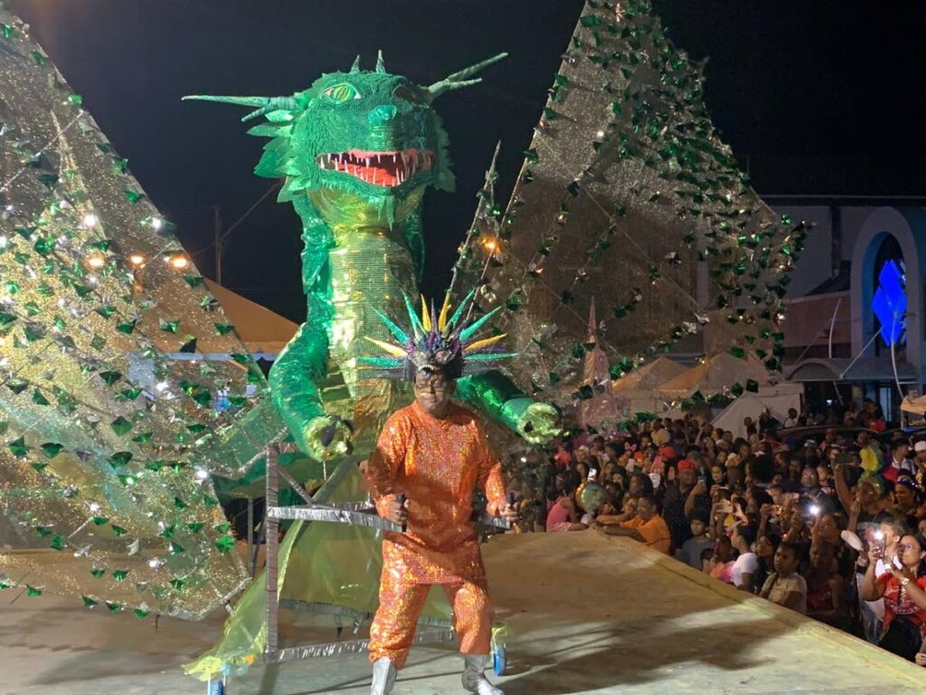 Mahindra Hardeosingh, King of Wing-O-Rama Band of the Year at Couva Carnival, dances his huge costume on Carnival Tuesday. - Photo courtesy Couva Carnival Committee