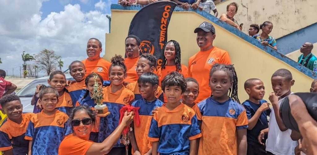 Concept Coaching Football Academy celebrate second place in the 2023 Under-8 Super League with organiser and coach Roger Smith (top right) - 