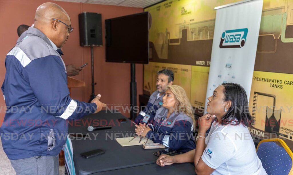 WASA CEO Keithroy Halliday, left, chats with directors Anand Jaggernath, Shaira Ali and Sharon Bailey at the Caroni Water Treatment Plant, Golden Grove Road, Piarco on March 8. - Photo by Jeff K Mayers