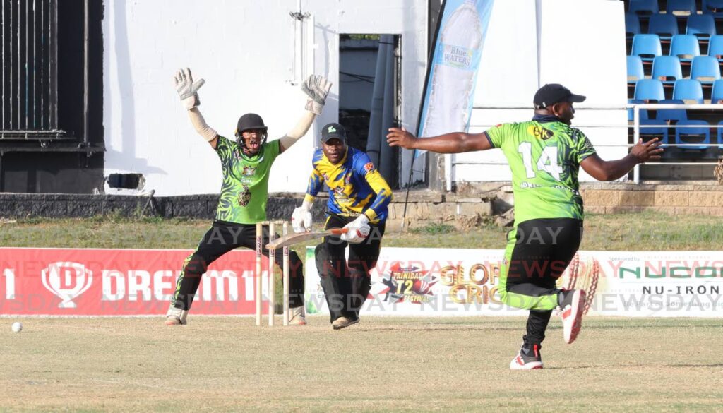 T20 FESTIVAL ACTION: Preysal bowler Adrian Cooper, right, unsuccessfully appeals against a Yorkshire batsman at the T20 Festival at Queen's Park Oval, St Clair on March 8. - Photo by Faith Ayoung  