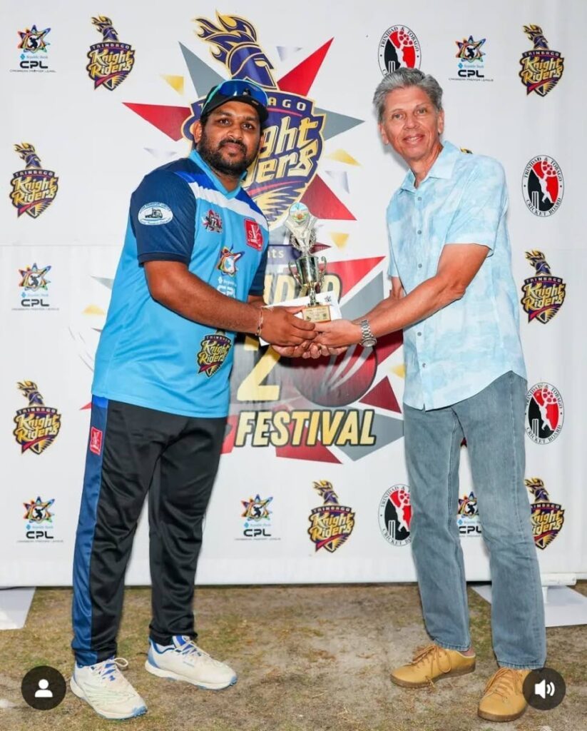 Victoria United's Shehan Jayasuriya, left, receives his player of the match award after scoring 33 runs in their 11-run triumph over Prisons when T20 Festival action continued at the Queen's Park Oval in St Clair on March 9.  - via T20 Festival