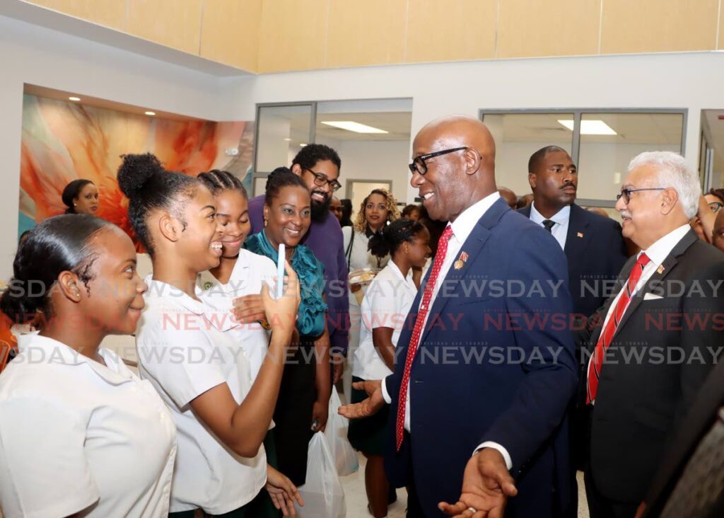 The Prime Minister interacts with members of the St Francois Girls' College Steel Ensemble during the Port of Spain General Hospital Central Block completion ceremony on March 10. - Photo by Ayanna Kinsale