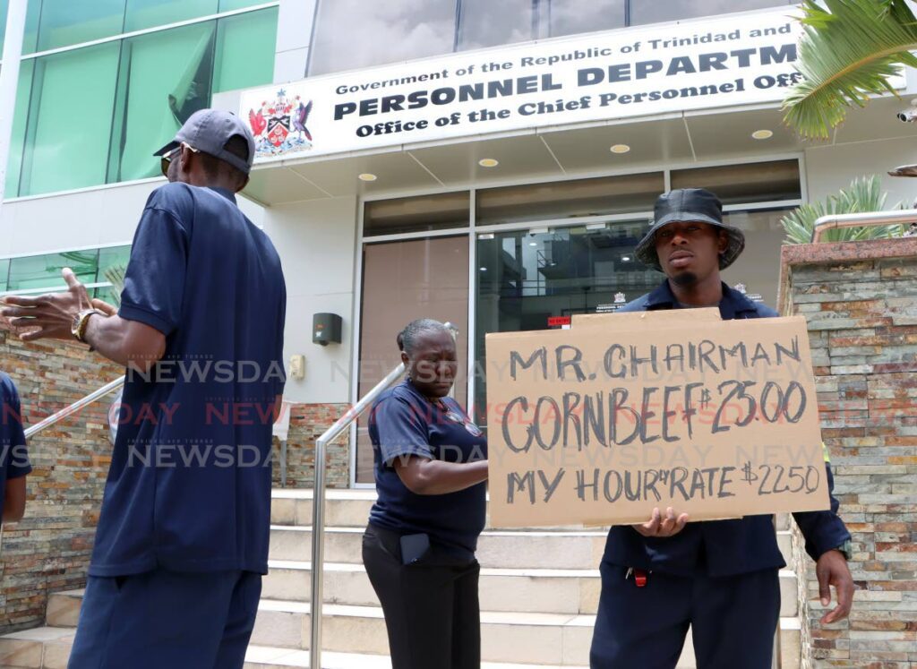 A Napet employee displays a placard that reads: 