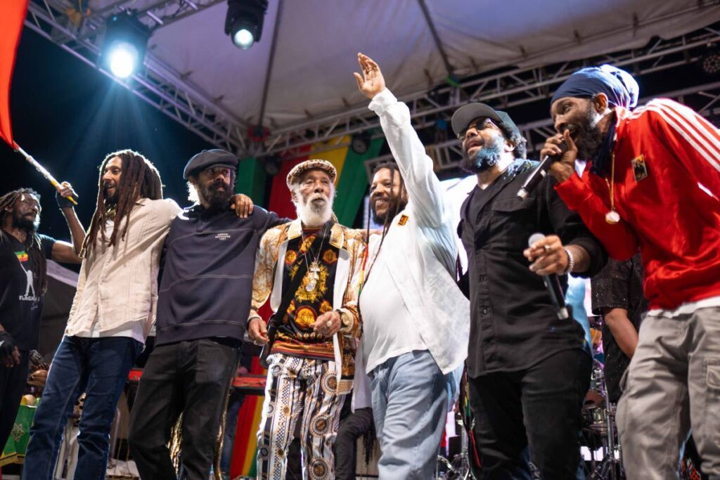 The Marley Brothers — Julian Marley, left, Damian ‘Jr Gong’ Marley, Stephen Marley and Ky-Mani Marley, second right, share a moment onstage with Big Youth and Spragga Benz, right, at the third annual Jo Mersa Marley Birthday Celebration held on March 8,  on the grounds of the Bob Marley Museum, Jamaica.  - 