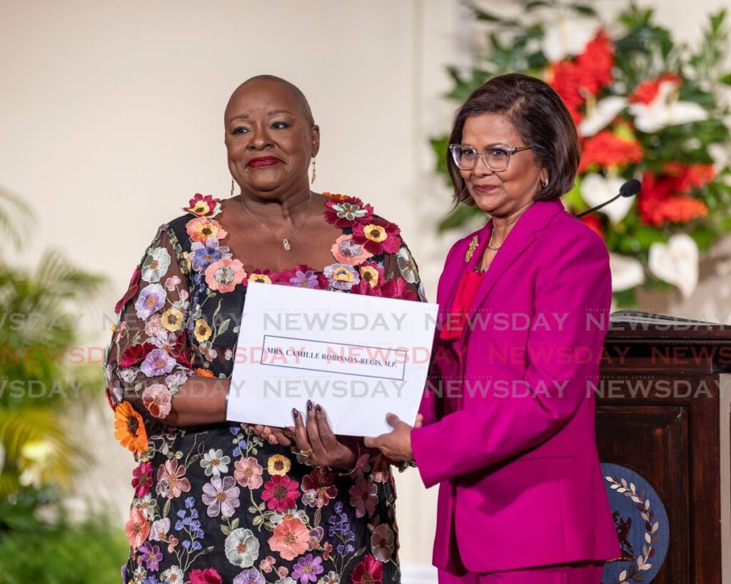 Camille Robinson-Regis receives her instrument of appointment as the Attorney General (AG) from President Christine Kangaloo at President's House, St Ann's on  March 17 -  Photo by Jeff K. Mayers