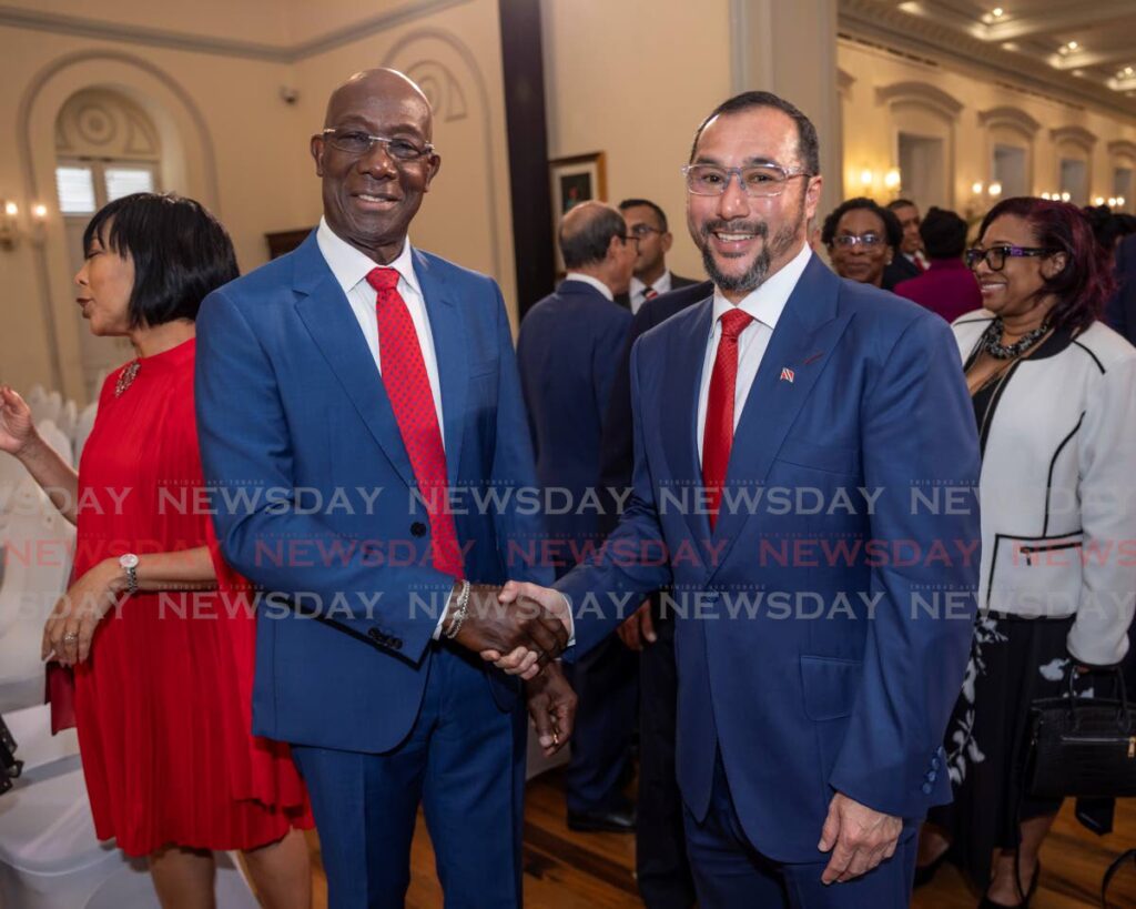 Prime Minister Stuart Young shakes hands with former prime minister and PNM political leader Dr Keith Rowley at the reception following the swearing-in ceremony at President's House, St Ann’s on March 17. - Photo by Jeff K Mayers 